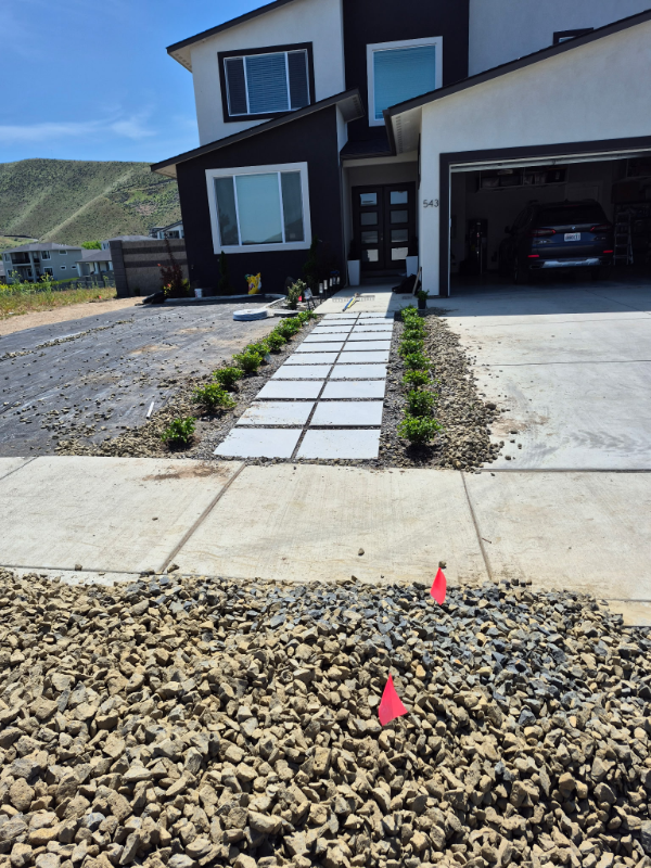Landscape design with rock features, mulch and plants